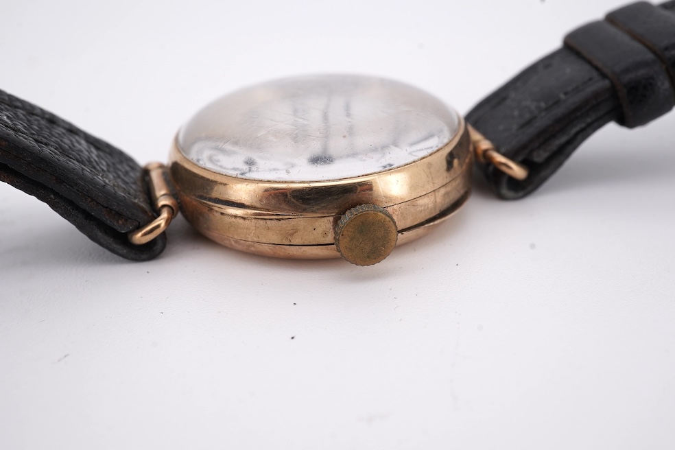 An early 20th century 9ct gold Zenith manual wind wrist watch, retailed by Favre Leuba, with Roman dial and subsidiary seconds, case diameter 28mm, on an associated leather strap. Condition - poor to fair
